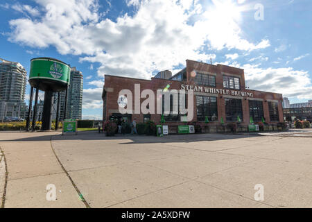 Wide-angle view of Steam Whistle Brewing on a sunny afternoon at Roundhouse Park in downtown Toronto. Stock Photo