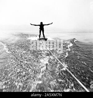 Eva Braun Collection - (album 1) -  Man skiing behind a boat on a board ca. 1930s Stock Photo