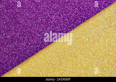 Shiny multicolored festive background. Multicolor paper diagonal background yellow, purple colors. Top view, copy space. Stock Photo