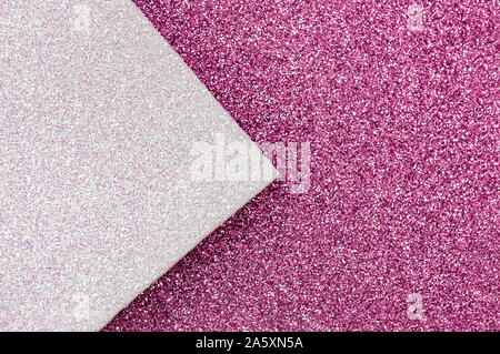Shiny multicolored festive background. Multicolor paper diagonal background pink, white colors. Top view, copy space. Stock Photo