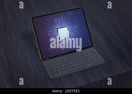 Tablet with mobile processor concept on display. Mobile processor market development concept. Stock Photo