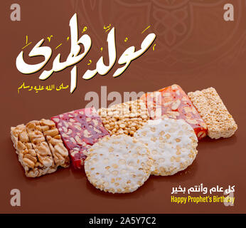 Greeting Card of Traditional Dessert and Arabic Text Saying Bith of The Guider Peace Be Upom Him, Prophet Muhammad Birthday Stock Photo