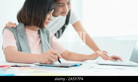 Coworking process. Designers team working modern office. Young creative manager showing new startup idea monitor. Designer graphic creative creativity Stock Photo