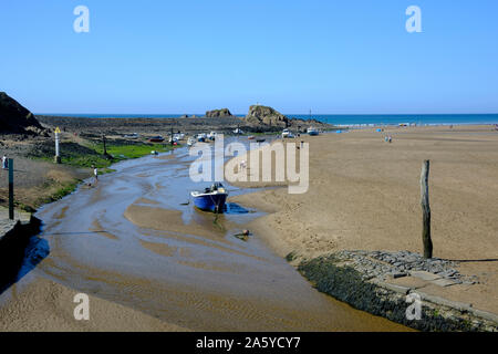View of the beach in Bude with Bude Canal coming to an end at the Sea Lock Bude Cornwall England Stock Photo