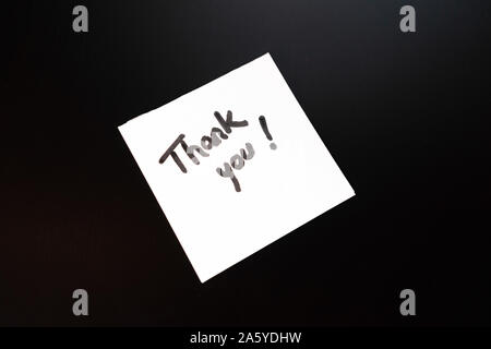 Writing Thank you! Sticky note with text Thank You! Text Thank you on paper. Stock Photo