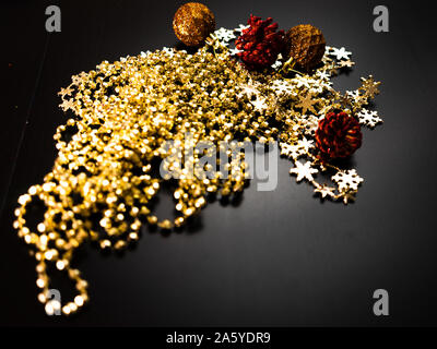 Christmas decorations on wooden board. Christmas concept. Colorful and glittery balls and garlands. Stock Photo
