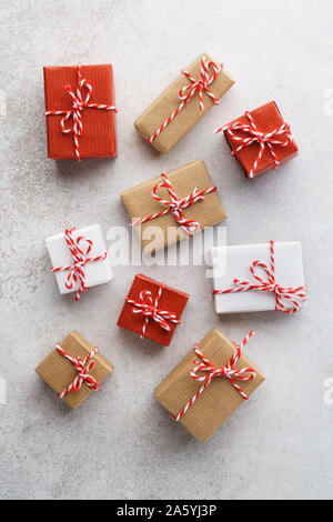 Various gift boxes decorated with colorful twine on gray background. Flat lay. Sale concept. Stock Photo