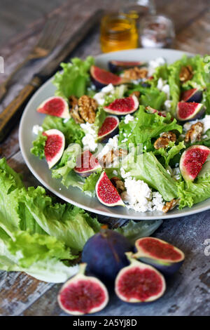 Green salad with figs and white cheese. Keto salad. Keto diet. Stock Photo