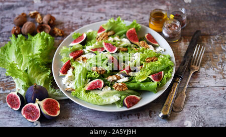 Green salad with figs and white cheese. Keto salad. Keto diet. Stock Photo