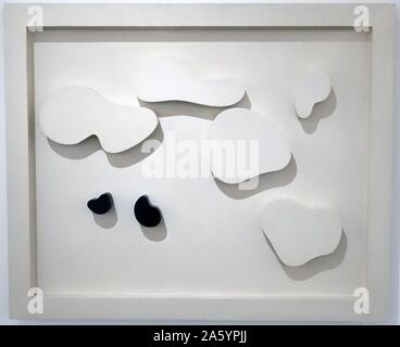 Constellation of five white shapes and two black shapes; 1932 Painted wood. By Jean Arp (Hans Arp) 1886 – 1966,s a German-French, or Alsatian, sculptor, painter. Stock Photo