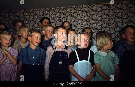 School children singing, Pie Town, New Mexico, USA. Creator Russell Lee, (1903-1986), photographer. Colour. October 1940. Stock Photo