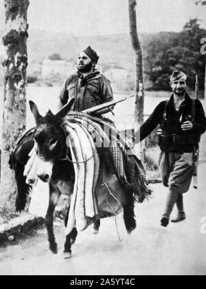 Spanish Civil War, republican soldier travels by donkey Stock Photo