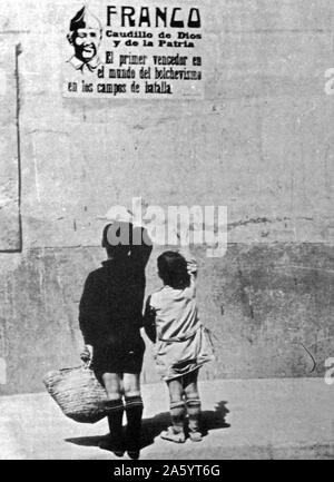 Children salute General Franco on a wall poster in Spain, during the Spanish Civil War. 1937 Stock Photo