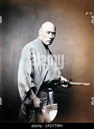 Japanese man in Kimono with sword 1890 by Felice Beato (1832 – 29 January 1909), an Italian–British photographer Stock Photo