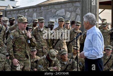 Photograph of United States Secretary of Defense Chuck Hagel (1946-) listening to a question from a U.S. soldier in Jalalabad, Afghanistan. Dated 2013
