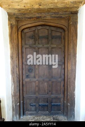 Tudor period main entrance wooden panelled door, at Sulgrave Manor, England, ancestral home of George Washington. 2015 Stock Photo