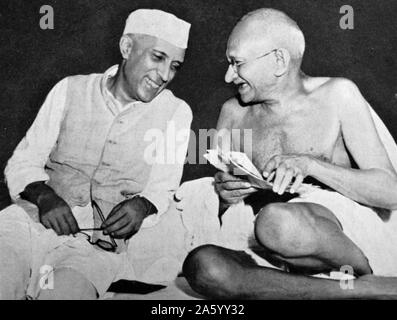 Pandit Jawaharlal Nehru, later Prime Minister of India, (left) with Mohandas Karamchand Gandhi (1869 – 1948), the preeminent leader of the Indian independence movement in British-ruled India. Stock Photo