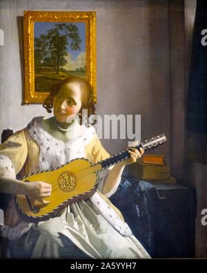 Painting titled 'The Guitar Player' by Johannes Vermeer (1632-1675) Dutch painter. Dated 17th Century Stock Photo