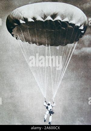 parachutist descends from 8000 feet 1930's Stock Photo