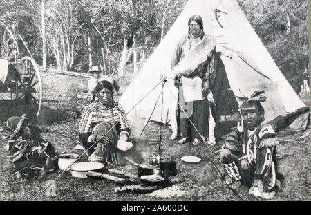 Native American Indians in front of a wigwam or tepee 1900 Stock Photo