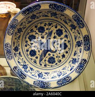 Dish with flying crane and arabesque design, from Iran. Dated 16th Century Stock Photo