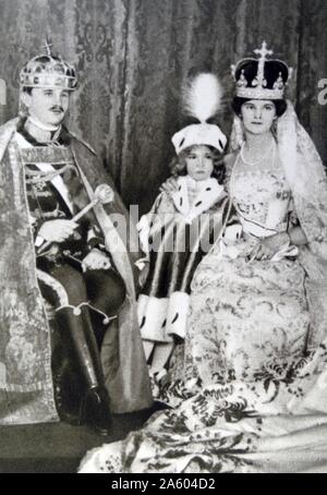 Photographic portrait of Zita of Bourbon-Parma (1882-1989), Emperor Charles I of Austria (1887-1922) and their eldest son Crown Prince Otto von Hasburg (1912-2011) after the Coronation in Hungary. Dated 20th Century Stock Photo