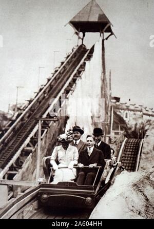 Photograph of Mary, Princess Royal and Countess of Harewood (1897-1965) and her brother Prince Albert Frederick Arthur George (1895-1952) riding the Scenic Railways at the Earls Court Exhibition. Dated 20th Century Stock Photo