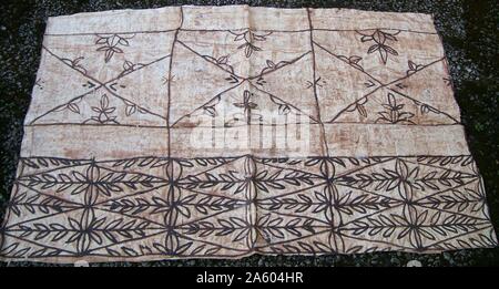 Painted Tapa, or Ngatu, from Tonga in the South Pacific. Tapa cloth is made from the inner bark of the mulberrytree (hiapo) and is used on ceremonial occasions. Stock Photo