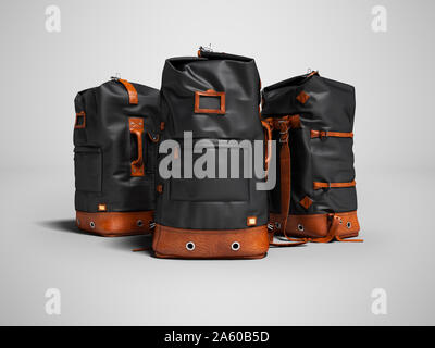 Three hiking black bags with leather inserts for the weekend in the mountains 3d render on gray background with shadow Stock Photo