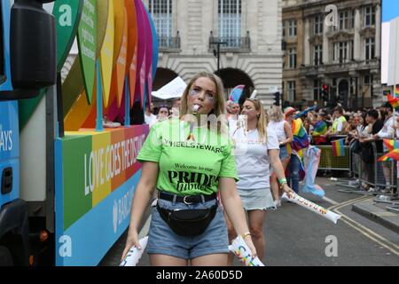 London, UK. 6th July, 2019. Pride Steward blowing a whistle during the parade.The 50th Pride Parade toke place through Central London with over one million participants. Credit: Pietro Recchia/SOPA Images/ZUMA Wire/Alamy Live News Stock Photo