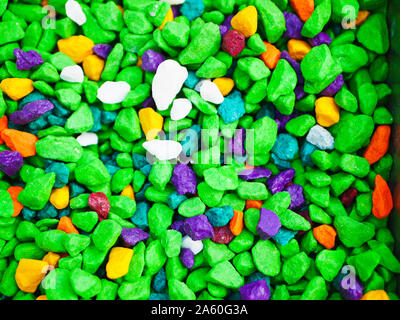 green little pebbles. The background consists of small green pebbles. With many possible uses. The texture is composed of tiny green pebbles. Stock Photo
