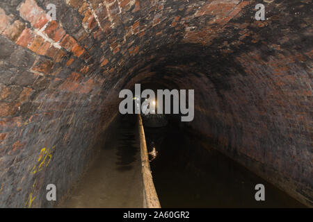 Narrow boats navigating the Chirk canal tunnel on the Llangollen canal in North Wales. Built in 1801 and designed by William Jessop and Thomas Telford Stock Photo