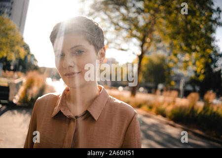 Portrait of confident woman in backlight Stock Photo