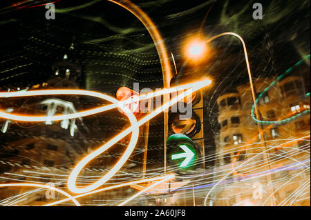 Traffic lights at luminous night in Madrid city, long exposure