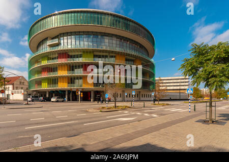 Modern glass building by street against sky in Malmo, Sweden Stock Photo