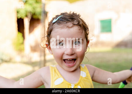 Portrait of a happy little girl outdoors in summer Stock Photo