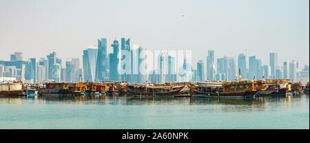Doha cityscape and dhow boats in the foreground Stock Photo