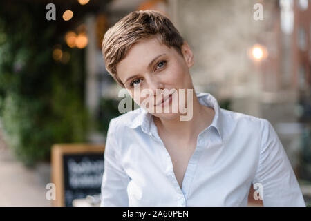 Portrait of a confident woman at a cafe Stock Photo