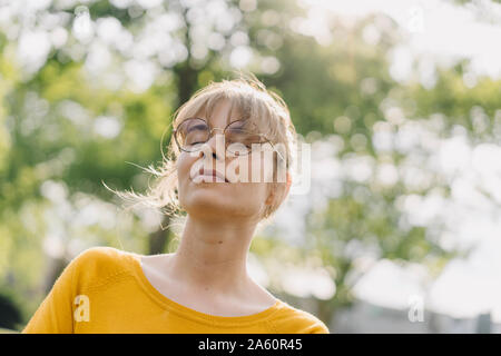 Portrait of young woman with closed eyes Stock Photo