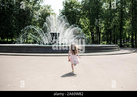 A Cute Smiling Little Girl Running Barefoot in a Countryside Landscape  Along a Country Path Stock Photo - Image of cute, field: 95093462