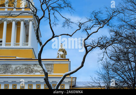 Ancient statue of a warrior covered with snow framed by arched branches on the Admiralty building (St. Petersburg) Stock Photo