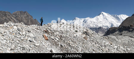 Young woman hiking in Sagarmatha National Park, Everest Base Camp trek, Nepal Stock Photo