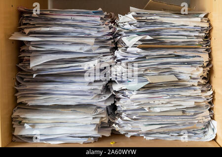 Pile of papers in shelf, close up Stock Photo