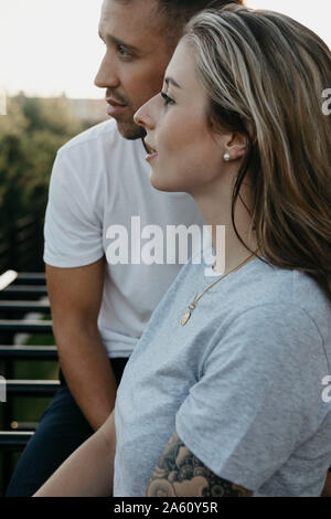 Young couple looking sideways Stock Photo