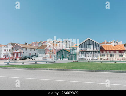 View of striped houses at the roadside, Costa Nova, Portugal Stock Photo