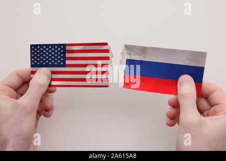 USA and Russia paper flags ripped apart. political relationship concept Stock Photo