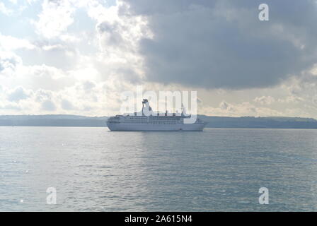 The cruise ship Astor anchored in Tor Bay, just off the town of Torquay, Devon, England, UK. Stock Photo