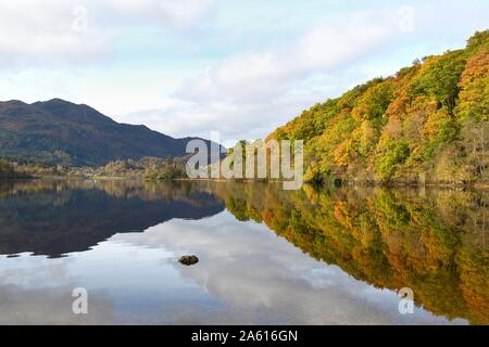 Scenic view showing Autumn colours along Loch Achray toward Ben Venue in the Trossachs, Stirlingshire, Scotland, UK Stock Photo