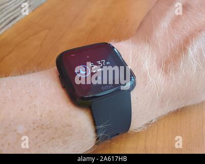 Close-up of arm of a man wearing a Fitbit Versa smart watch displaying sleep tracking data, a recently expanded capability of several Fitbit products, San Ramon, California, September 12, 2019. () Stock Photo