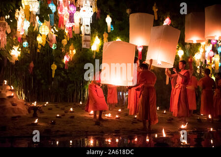 Monks celebrating Loy Krathong with lanterns at Wat Phan Tao, Chiang Mai, Thailand. Stock Photo